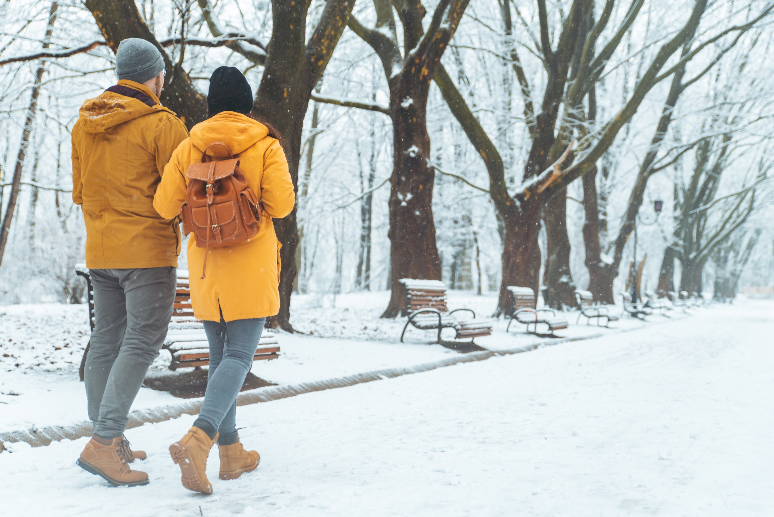 A couple out walking in winter weather.